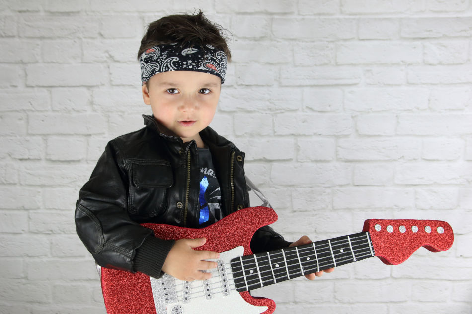 Little Boy Wearing a Bandana Playing Electric Guitar